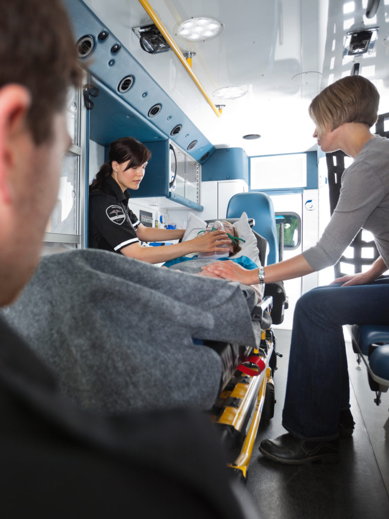 Woman in ambulance after a serious injury