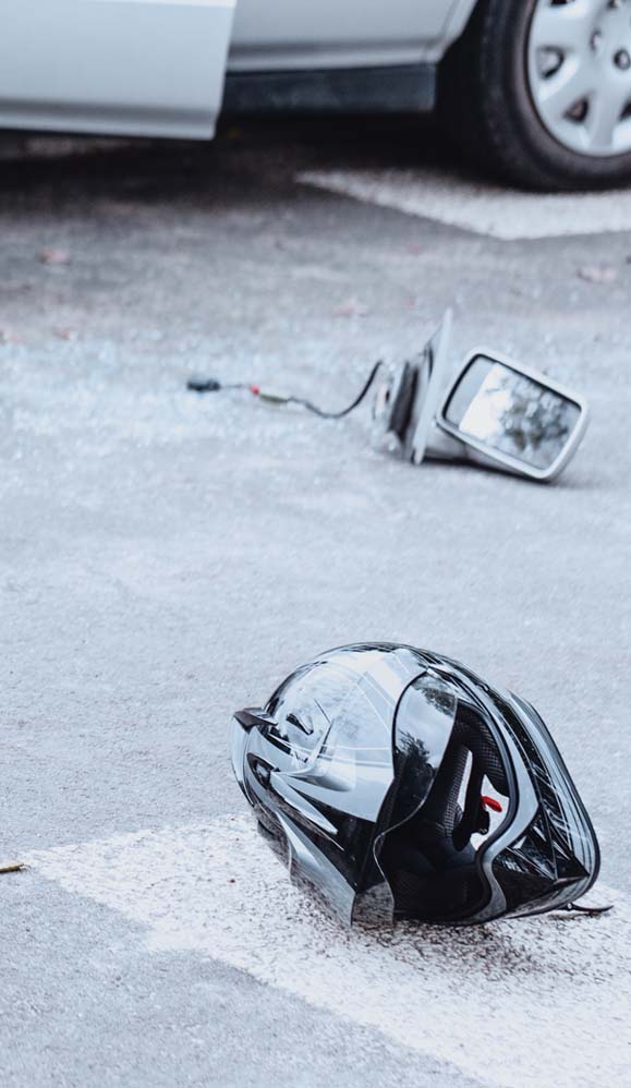 Helmet on the pavement after fatal motorcycle accident
